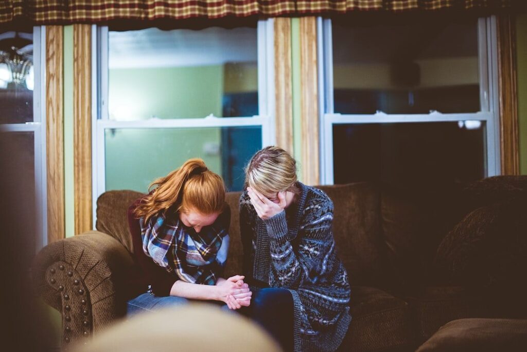 Two women crying together