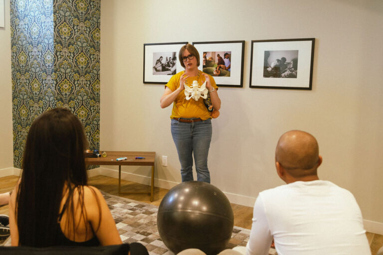 Latino couple taking prenatal class