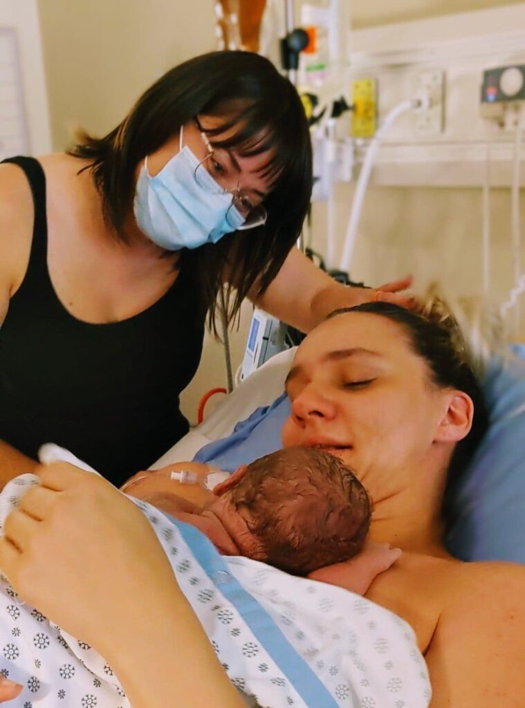 Newborn baby with new mother and auntie